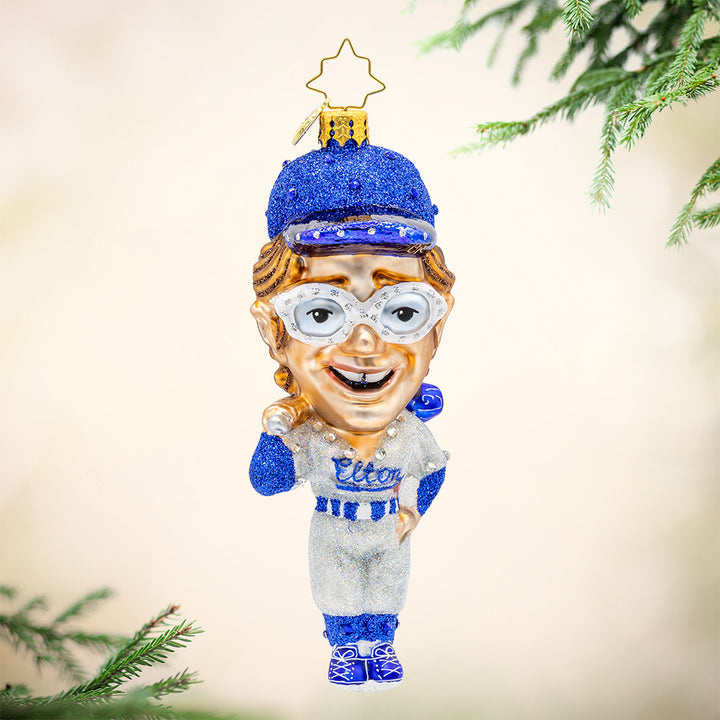 Elton's Grand Slam ornament. Featuring the iconic musician in a full-on baseball getup. View of front.