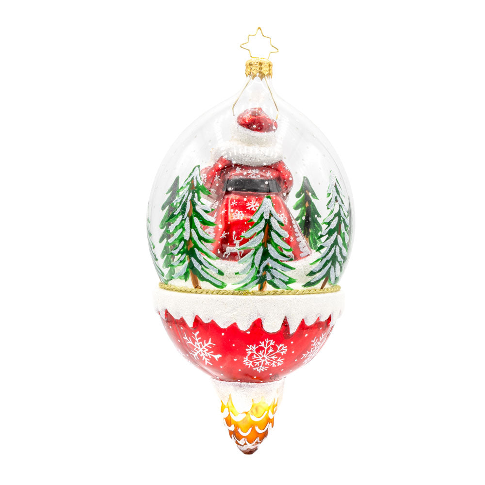 Winter Wanderlust ornament. This dome features a jolly Santa exploring a snowy forest with a playful deer. The shimmering snow, twinkling lights, and festive details create a magical atmosphere. View of back.