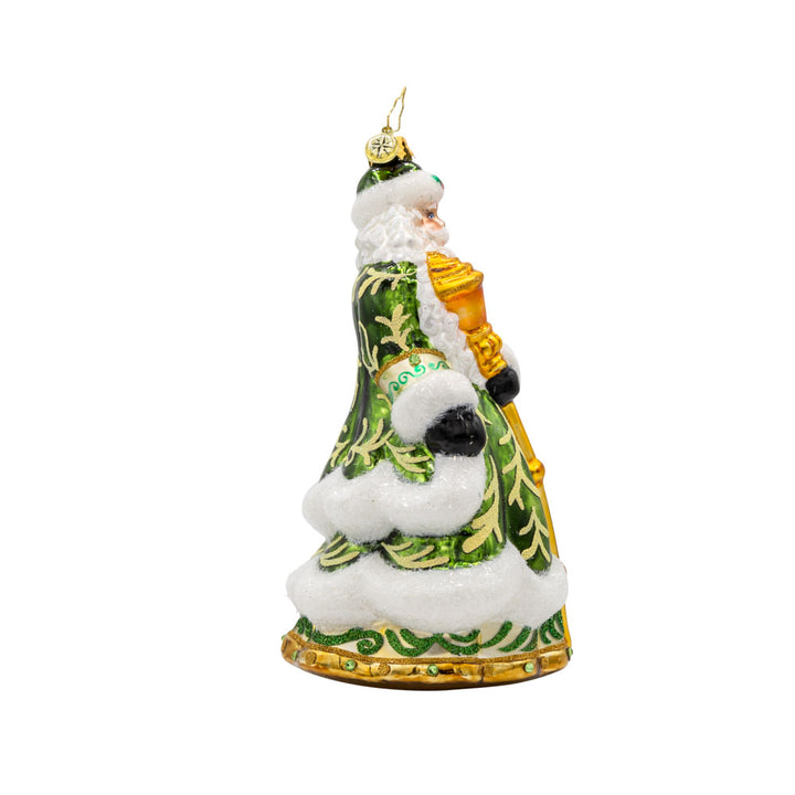 This European-style Santa Claus ornament dons a vibrant green robe, adorned with intricate details and shimmering embellishments. View of left side.