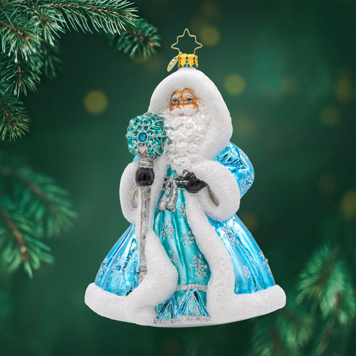 This Santa Claus ornament dons a blue robe, meticulously crafted and adorned with exquisite details. Viewed from front.