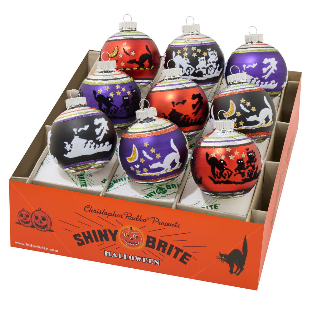 9 count Halloween Shiny Brite ornament set. Vibrant, vintage-inspired ornaments feature classic Halloween scenes.