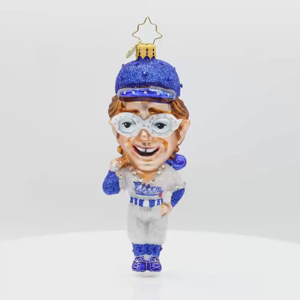 Elton's Grand Slam ornament. Featuring the iconic musician in a full-on baseball getup. Video.