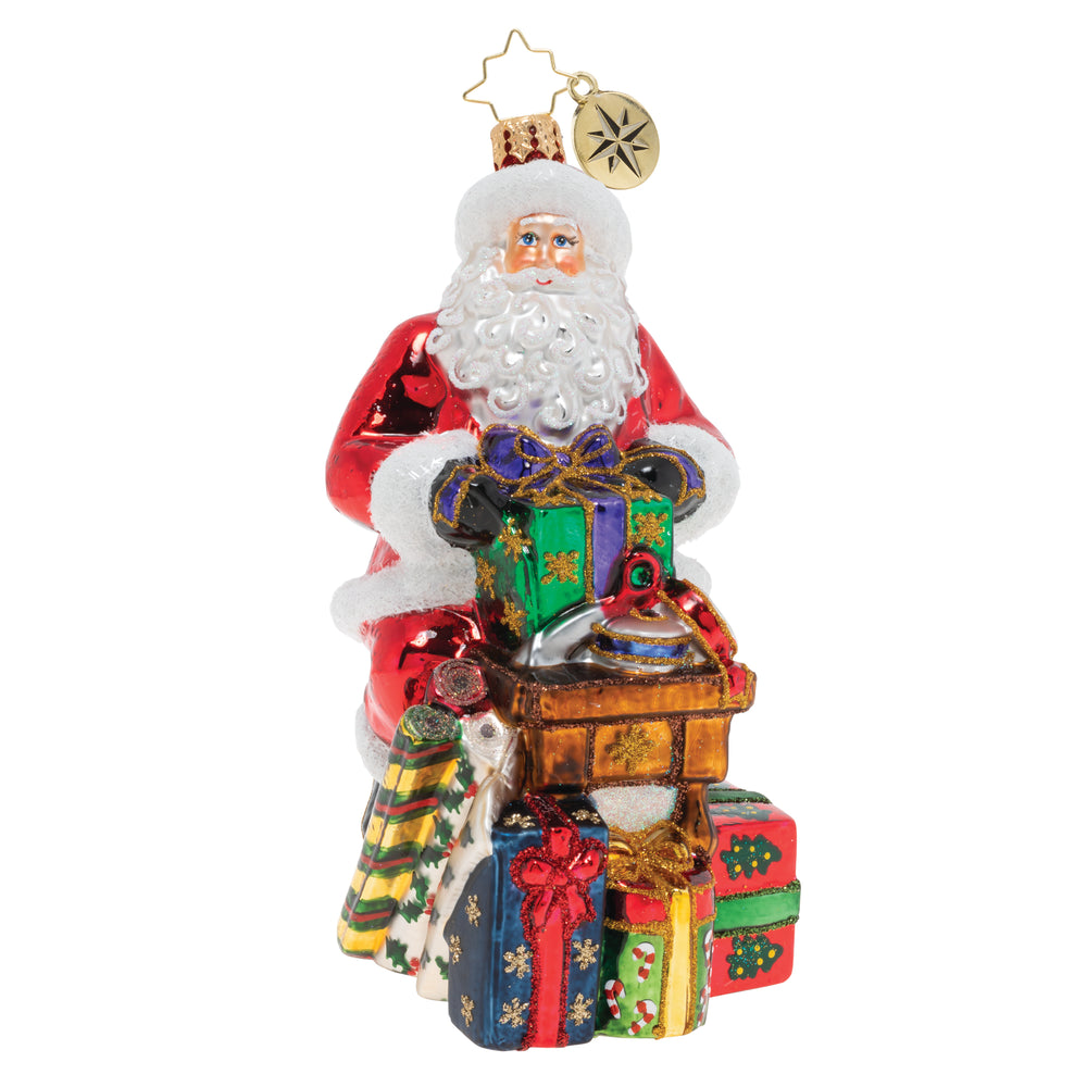 Front - Ornament Description - Workshop Wonders: Santa is wrapping gifts for the holiday! His nimble fingers and eye for detail make him a gift wrapping extraordinaire!