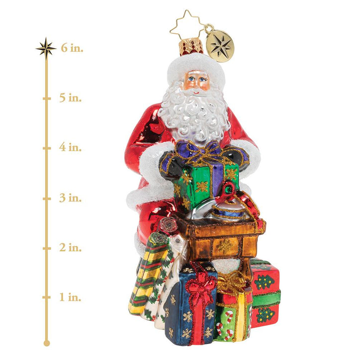 Ornament Description - Workshop Wonders: Santa is wrapping gifts for the holiday! His nimble fingers and eye for detail make him a gift wrapping extraordinaire! This photo shows the ornament is about 6 inches tall. 