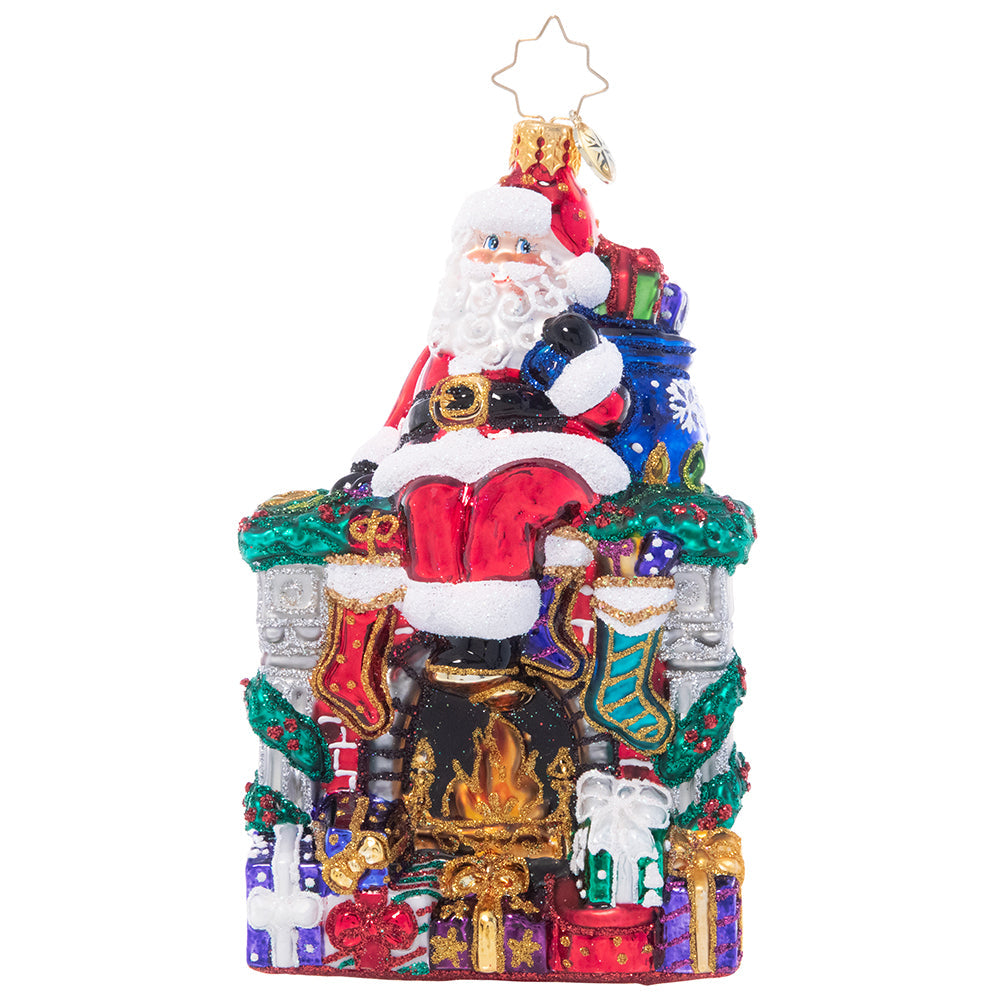 Ornament Description - A Perfect Place to Perch: During a long night of making Christmas magic around the globe, even Santa needs a little break. He finds a spot to sit on the mantle of a roaring fireplace and admires his job well done!