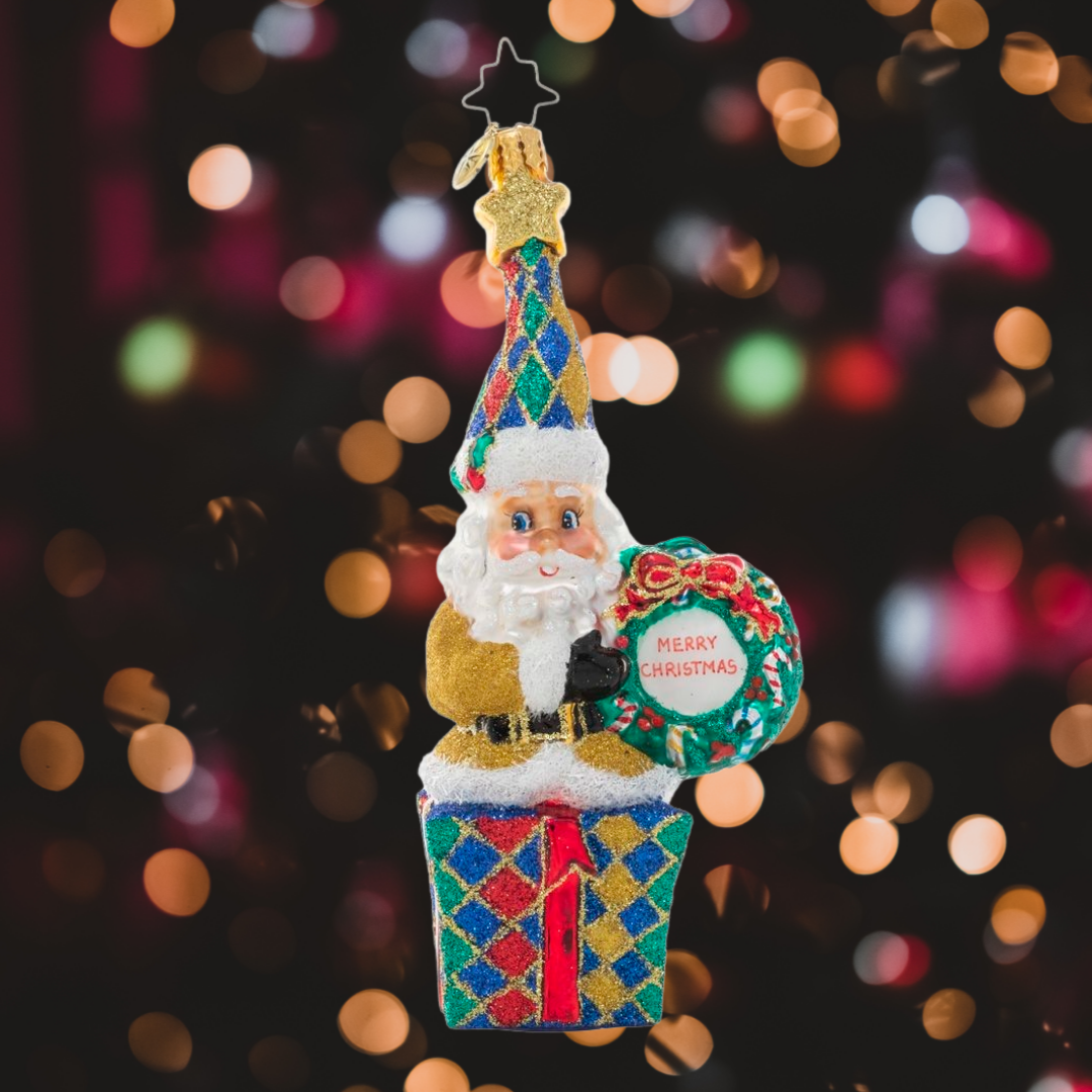 Ornament Description - Christmas Wishes Santa: Dressed in a glittering gold jacket and jewel-toned hat, it's clear that this Santa's favorite thing about Christmas is all the shiny things! He's sending wishes for a holiday filled with good fortune!