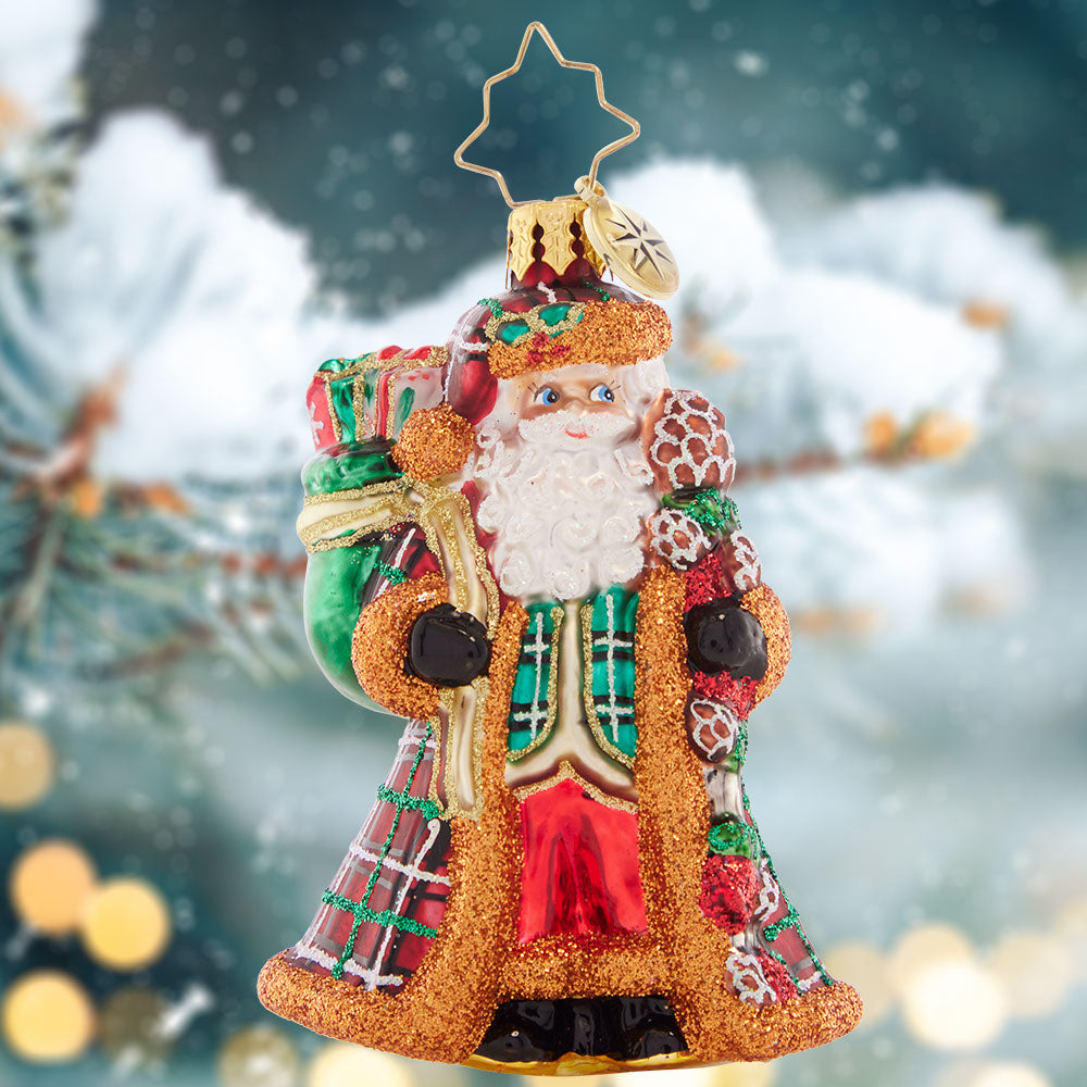 Ornament Description - Perfectly Plaid Santa Gem: Santa is looking posh in a plaid, fur-trimmed coat. He'll be cozy warm as he walks through the snowy woods of North Pole.