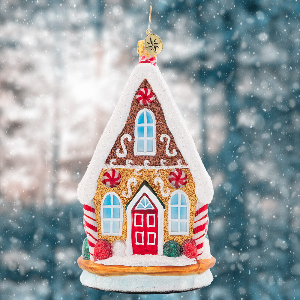 Ornament Description - Sweetest Chalet: That's one cozy-looking cookie chalet! Adorned with snow made of icing, gooey gumdrops, and peppermint accents, this little house sure sweetens up the neighborhood.