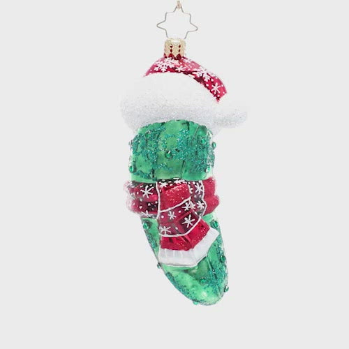 Video - Ornament Description - Chilly Christmas Pickle: The weather outside is quite frightful, but the fire is so dill-ightful! This playful pickle is all bundled up for the cold. Find him hidden in your tree for good luck!