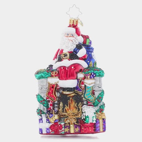 Video - Ornament Description - A Perfect Place to Perch: During a long night of making Christmas magic around the globe, even Santa needs a little break. He finds a spot to sit on the mantle of a roaring fireplace and admires his job well done!