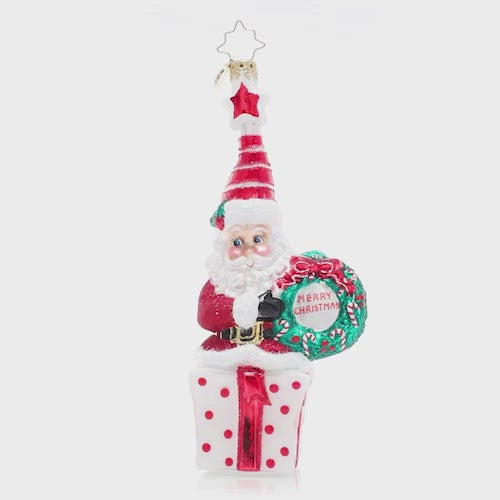 Video - Ornament Description - Vintage Vibrance: This cheery little Saint Nick wishes you a very Merry Christmas! Dressed in glittering ruby red and an extra-festive Santa cap, this jolly elf is ready to celebrate the season. This video shows the ornament spinning slowly. 