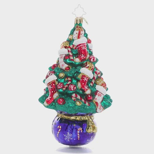 Video - Ornament Description - Candy Cane Conifer: This handsome holiday tree gets a bit of a peppermint twist with candy cane-themed ornaments. Pops of swirled red and white accent the deep green of the branches for a classic Christmas look!